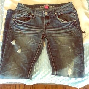 Boot cut jeans , missing pearls on pockets .